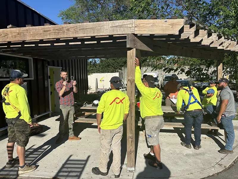 Construction workers doing safety training outdoors