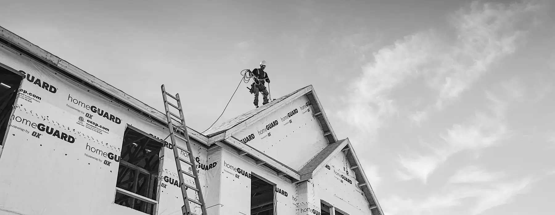 Construction worker walking on roof