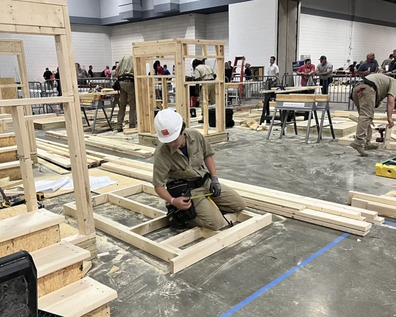 Students learning construction skills