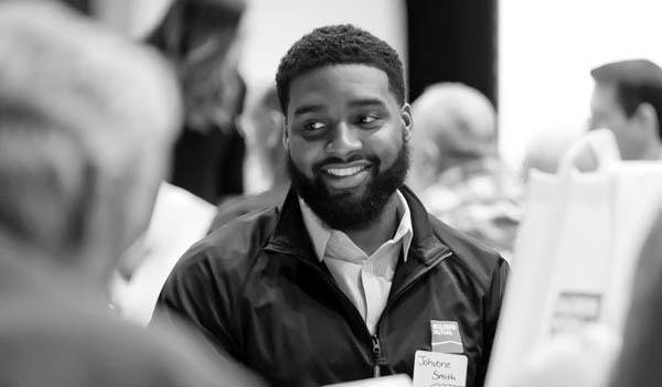 Smiling man at career event