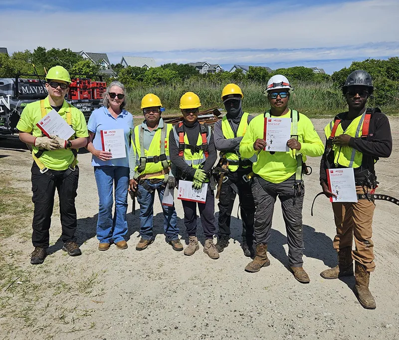 Construction worksers showing awards