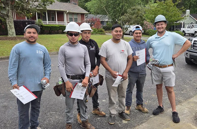 Construction worksers showing awards